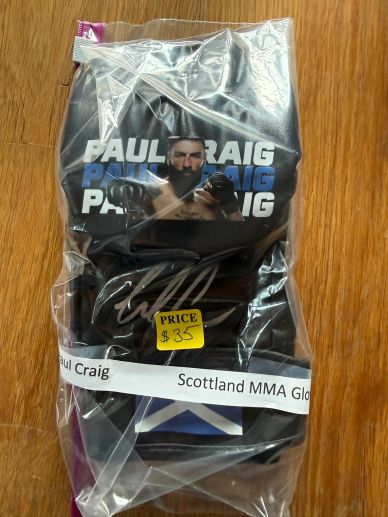 Packaged gloves with Paul Craig MMA design.