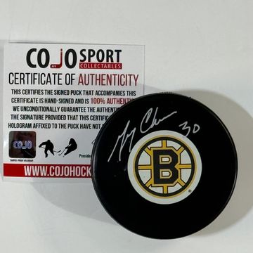 Autographed Boston Bruins hockey puck with authenticity certificate.