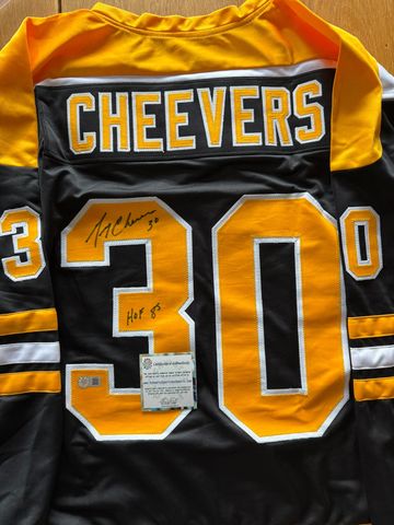 Autographed hockey jersey with Cheevers name and number 30.