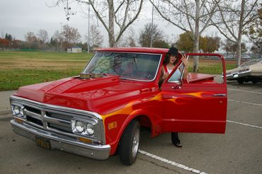 Red classic truck with Solanis 707 Car, and Bike club, West Sacramento, California. Annual Toy Drive