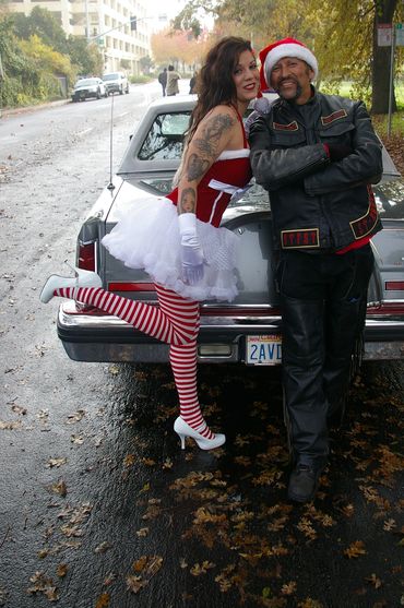 Christmas elf is standing behind this gentleman's car in Sacramento, California. Devotions Car Club
