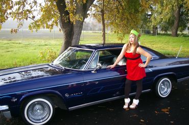 This elf caught herself a smooth ride with Devotion Car Club Owner at the Toy Drive Downtown, Sac.
