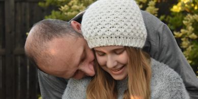 Portrait of a father and his beautiful daughter, the embrace of a loving father.