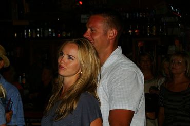 These two lovers embrace at the Powerhouse Pub with Left of Centre on stage shaking it up in Folsom.