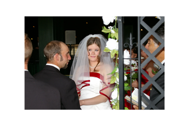 United as one with white roses dangling on a trellis beside them. Artistic Photographer Kristy Urain