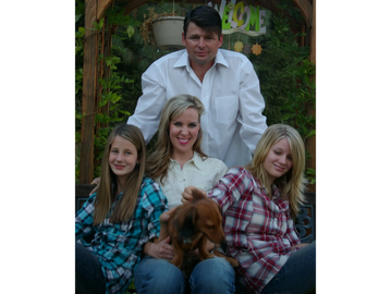 Family portrait in their garden with their dog framed perfectly