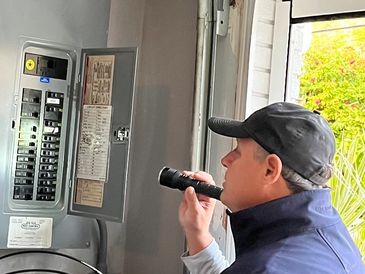 Man Working on an Electrical Panel