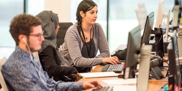 people doing a training on a Personal computer.