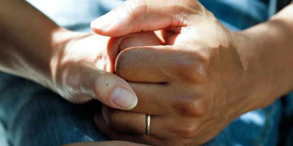 people holding hands.