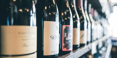 closeup shot of wine bottles in a rack 