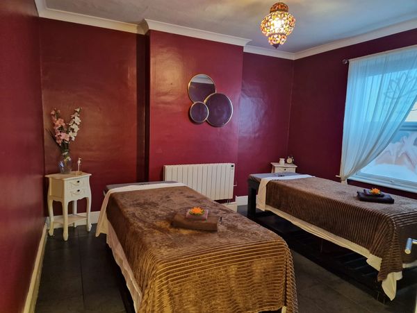 Thai massage parlor with red painted walls.