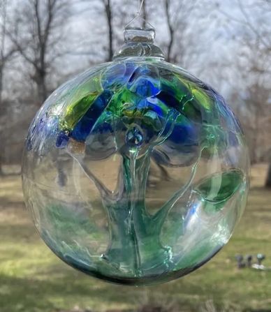 Glass art - a blue and green "witches ball"