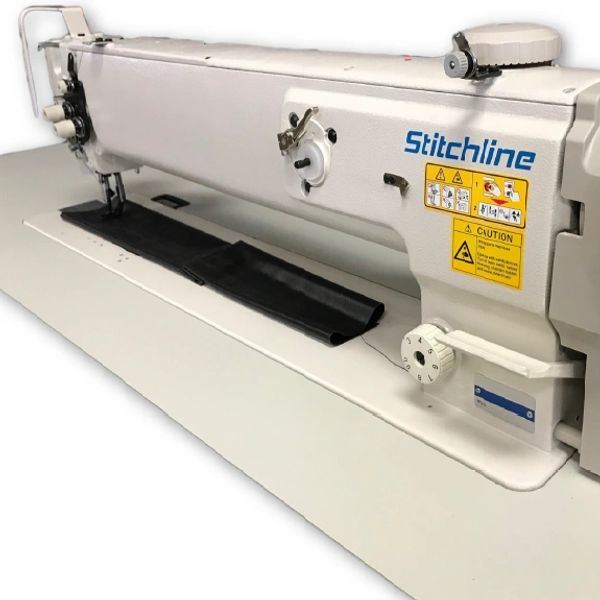 Industrial Stitchline sewing machine with black fabric.