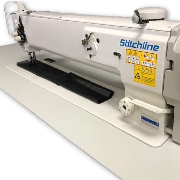 Industrial Stitchline sewing machine with black fabric.