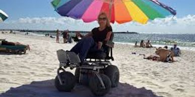 Women in accessible beach chair