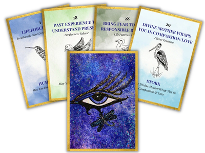A set of spiritual oracle cards with symbolic images and messages.