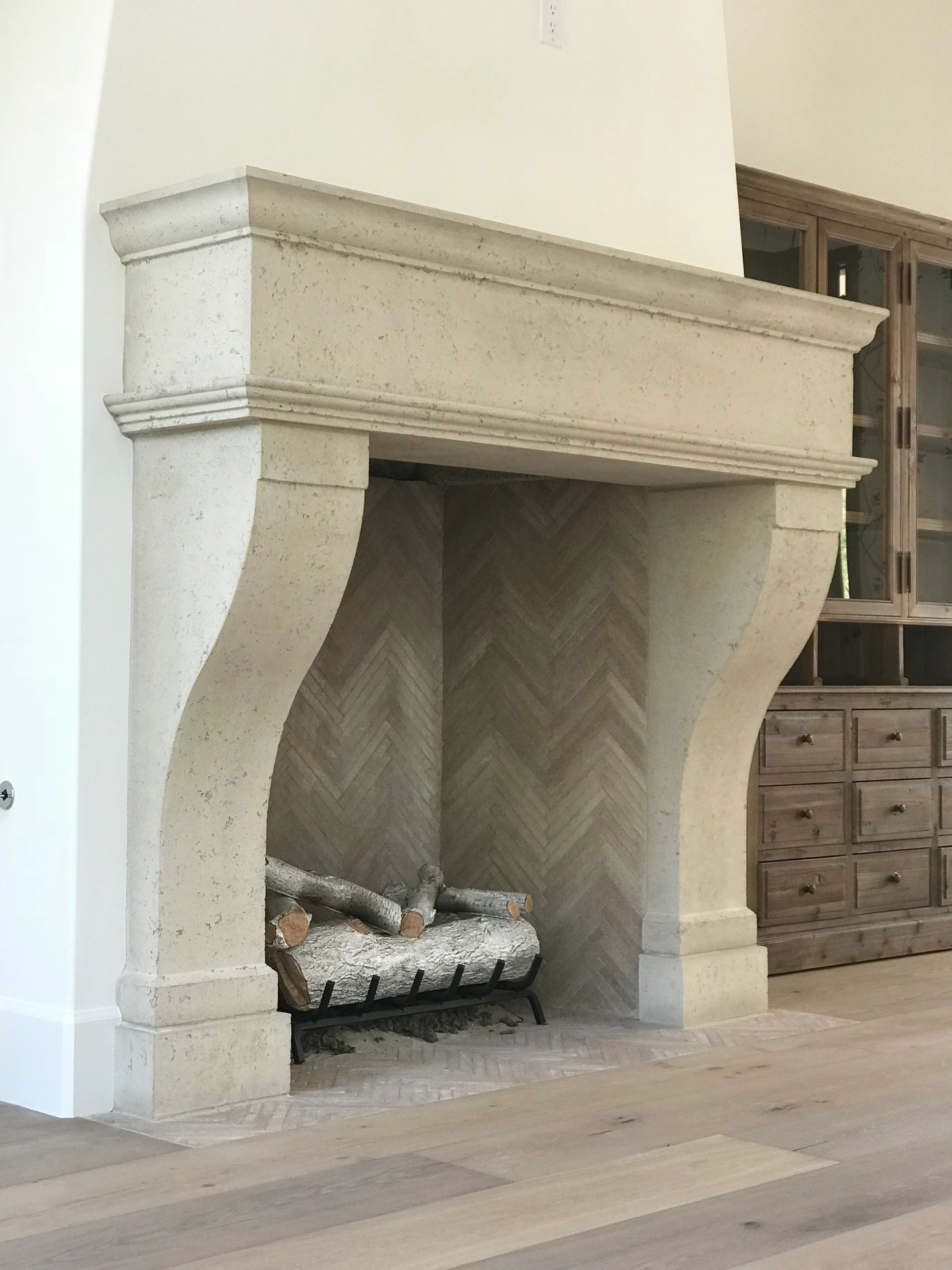 Realm of Design mantle with finger split herringbone firebrick...
