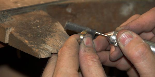 a man creating jewelry.