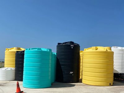heavy wall flat bottom chemical tanks ranging in colors and sizes