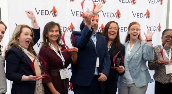 Virginia Economic Developers smiling, holding awards. EQALL powered a win for Harrisonburg.