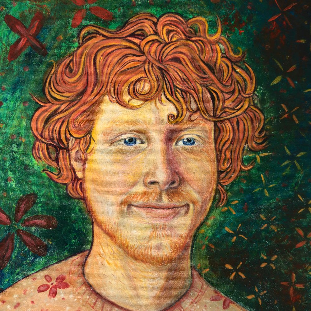 A portrait of a smiling man with scruffy red hair, painted on canvas.