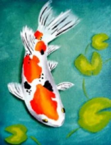 white koi fish with red spots and black spots next to lily-pads