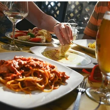 Closeup shot of food and a beer glass on the table 
