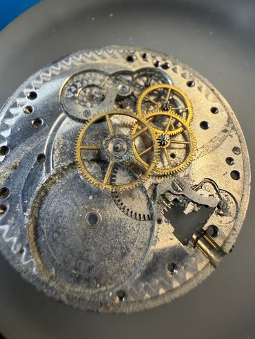 Close-up of vintage watch gears and mechanisms.