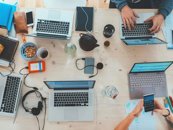 A group of people working at a desk