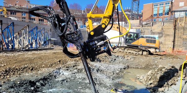 EX560 hydraulic rock drill attachment for installing drill holes for the Darda C20. 
