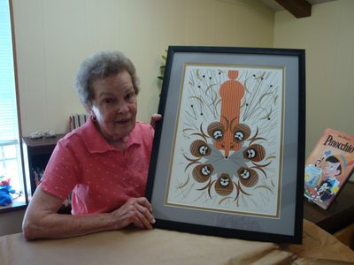 Ruth Lee with fox picture that she donated to the library. 