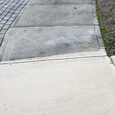 Before and After pressure cleaning exterior sidewalk