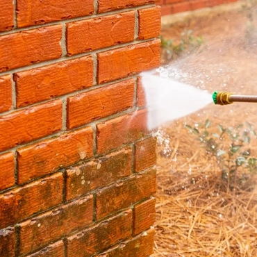 Before and After pressure cleaning a brick wall