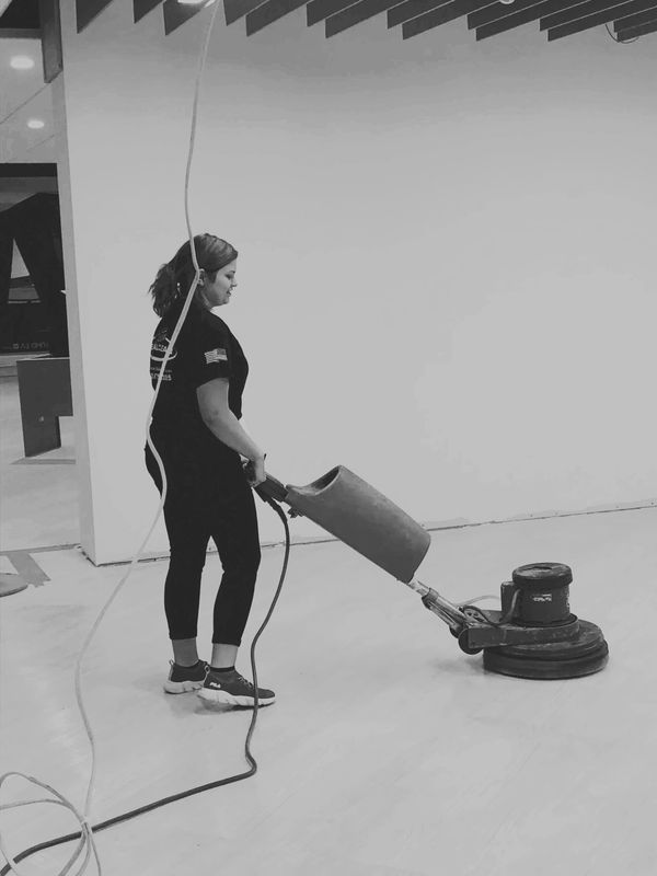 A photo of a Team Real Clean employee performing our floor waxing and stripping service.