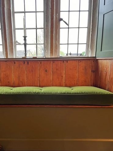 window seat. cotswolds home. green velet fabric