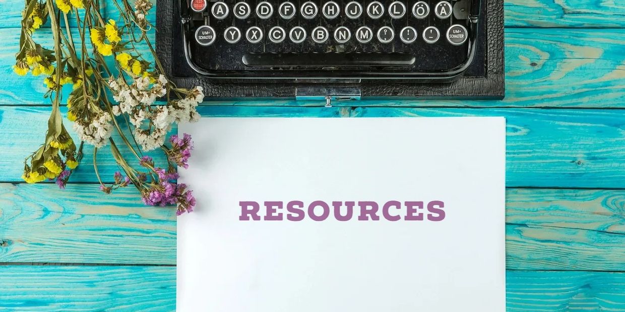 Typewriter with the word resources printed on a white page