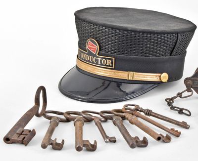 Antique railroad keys and conductor hat