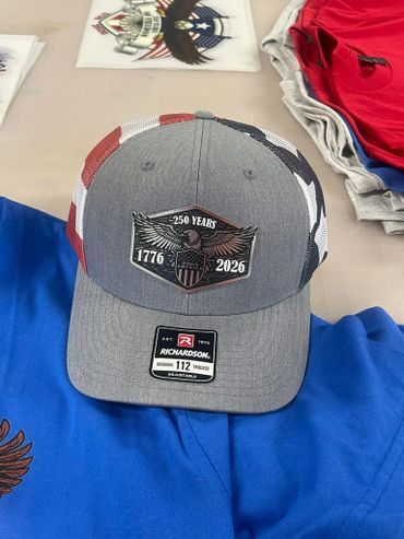Gray cap with American flag design celebrating 250 years from 1776 to 2026.