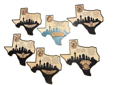 Wooden Texas-shaped plaques featuring city skylines and text details.