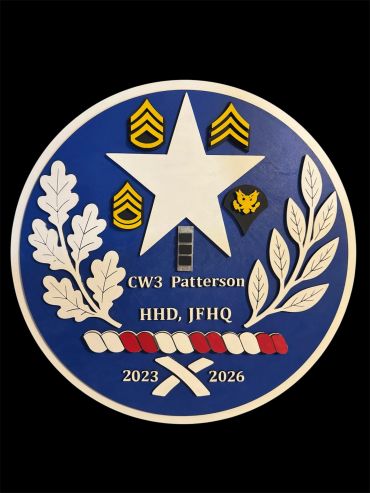 Military emblem with rank insignias and oak leaves.