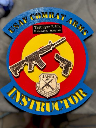 USAF Combat Arms Instructor plaque with weapons and badge.