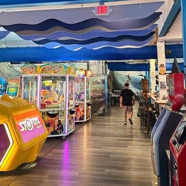 Noise absorbing wave baffles for ocean boardwalk arcade