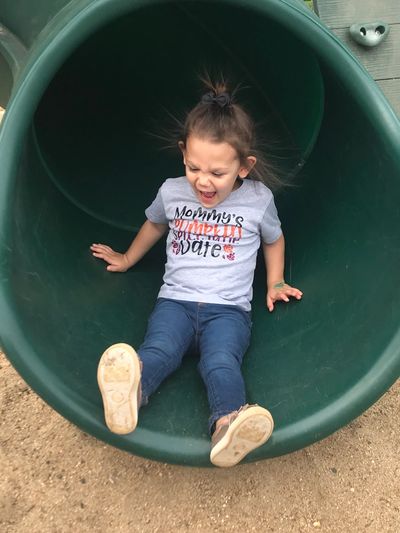 child on a slide early intervention services