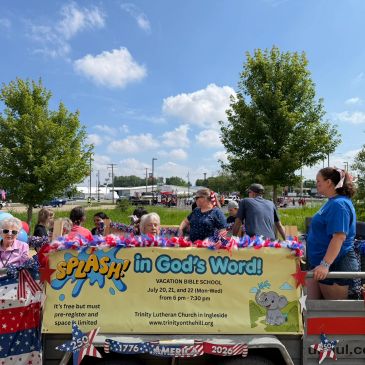 People preparing a float decorated for a Vacation Bible School event.