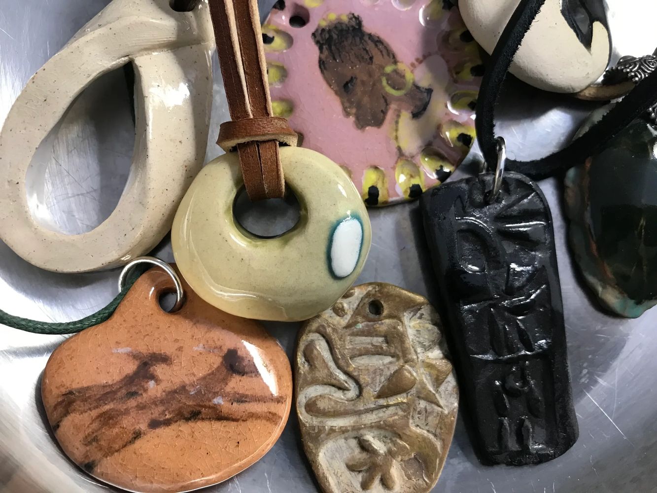 A group of  ceramic pendants from the collection