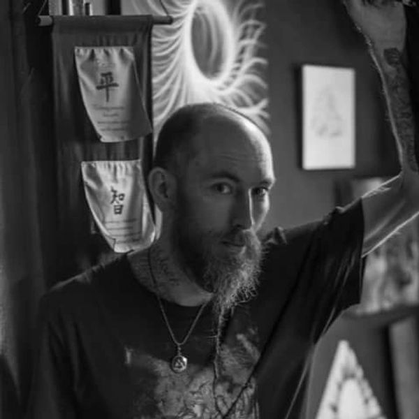 Black and white photo portrait of Rip Van Wagoner in his studio and gallery