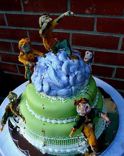 I worked with someone in a theatre group who wanted a zombie themed cake for an opening. I made this because I'd been reading about victorian royal icing work and the Lambeth decorating style, so I spent 12 hours making this cake and then charged her like $20. I worked with someone in a theatre group who wanted a zombie themed cake for an opening. I made this because I'd been reading about victorian royal icing work and the Lambeth decorating style, so I spent 12 hours making this cake and then charged her like $20.