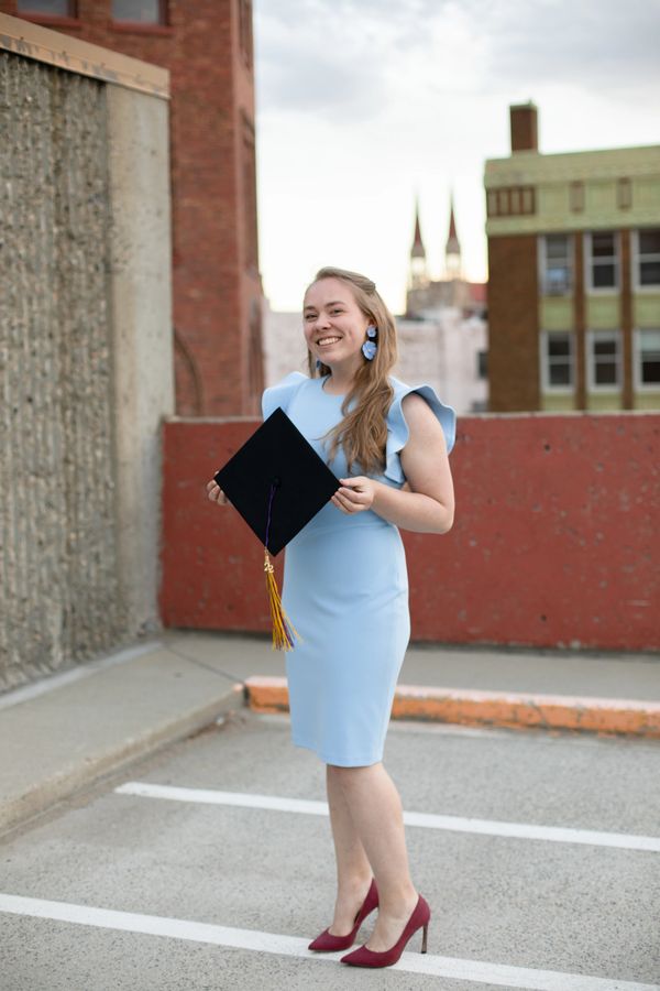 A montana senior student in Helena holds graduation cap in her hands. She studies at Carol College
