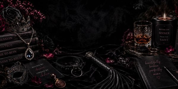 Dark, elegant gothic scene with luxurious objects and a candle.