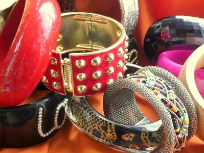 selection of pre owned coloured bangles and beaded silver bangles